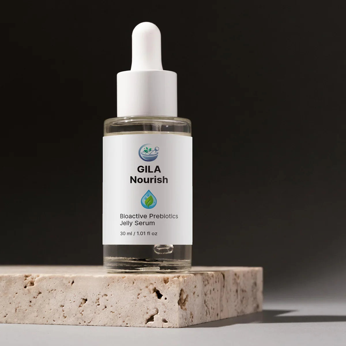 Bottle of GILA Nourish Bioactive Prebiotics Jelly Serum on a stone surface with a dark background