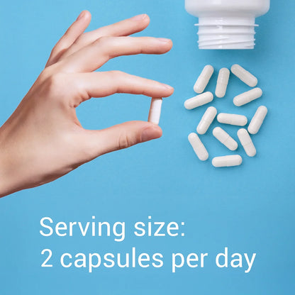 Hand holding a capsule with text about serving size on a blue background