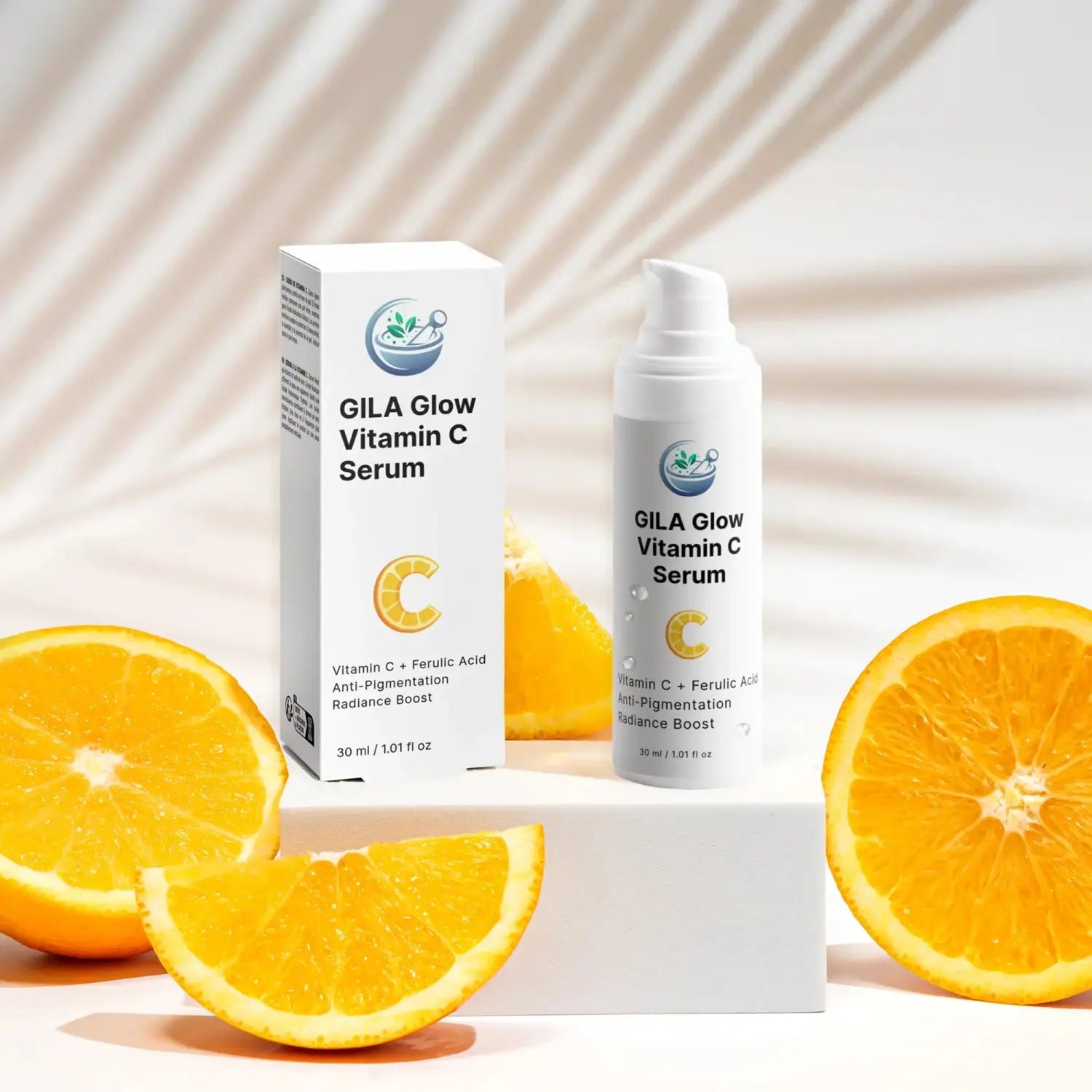 GILA Glow Vitamin C Serum bottle and its white box, positioned on white display blocks, surrounded by bright orange slices. A soft, blurred palm frond is visible in the background.