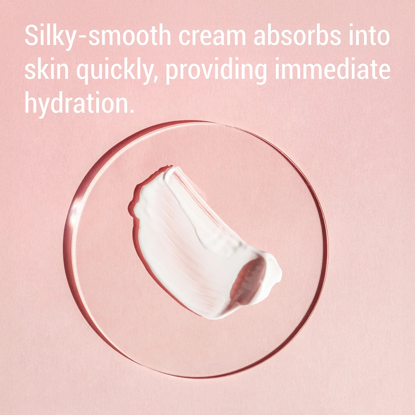 A pink cosmetic-style background with white text reading, 'Silky-smooth cream absorbs into skin quickly, providing immediate hydration.' Below the text is a clear circular ring containing a white cream smear.