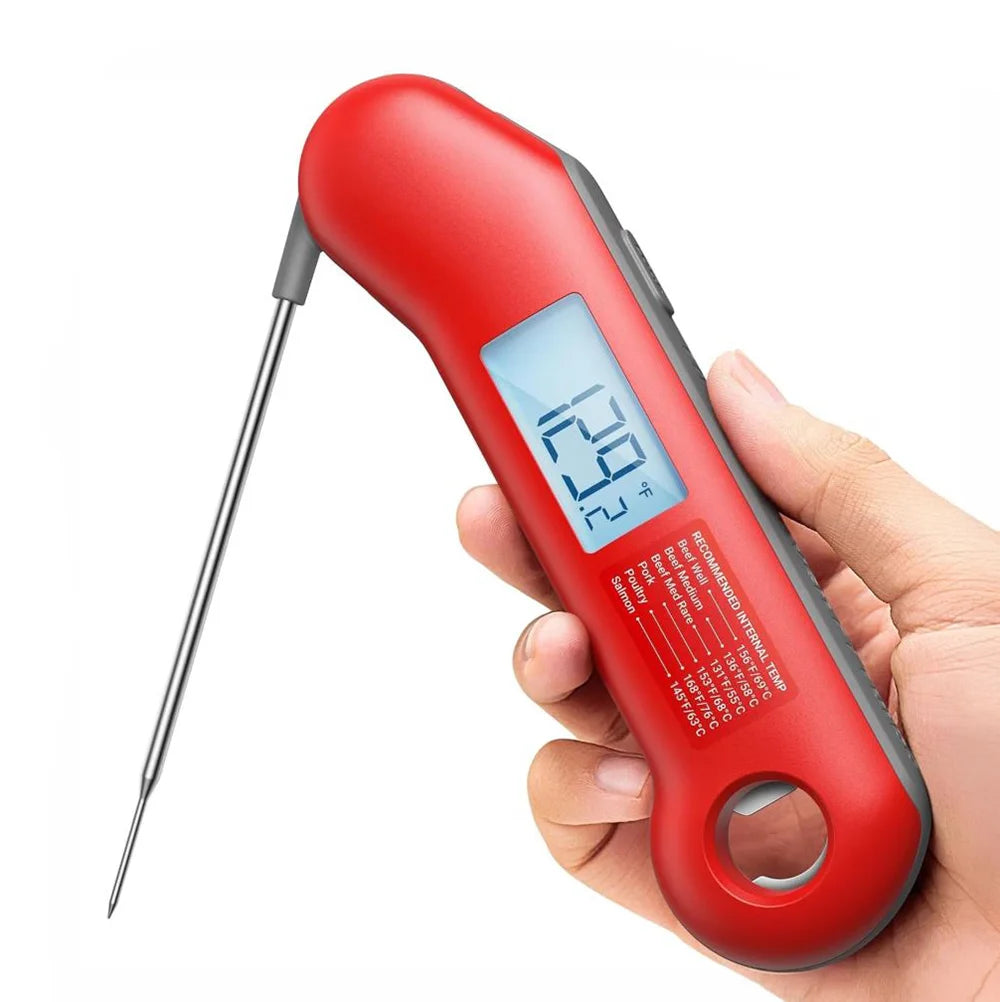 A hand holding a ThermoMaven food thermometer