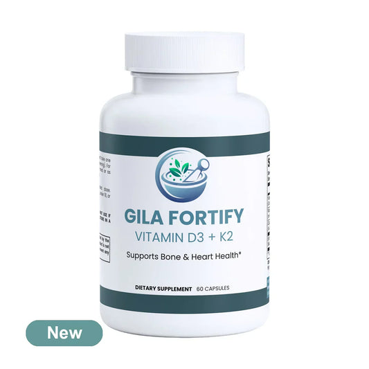 A white plastic bottle of Gila Fortify Vitamin D3 + K2 dietary supplement with a white cap, featuring a dark green and white label. A teal 'New' badge is visible in the bottom-left corner.