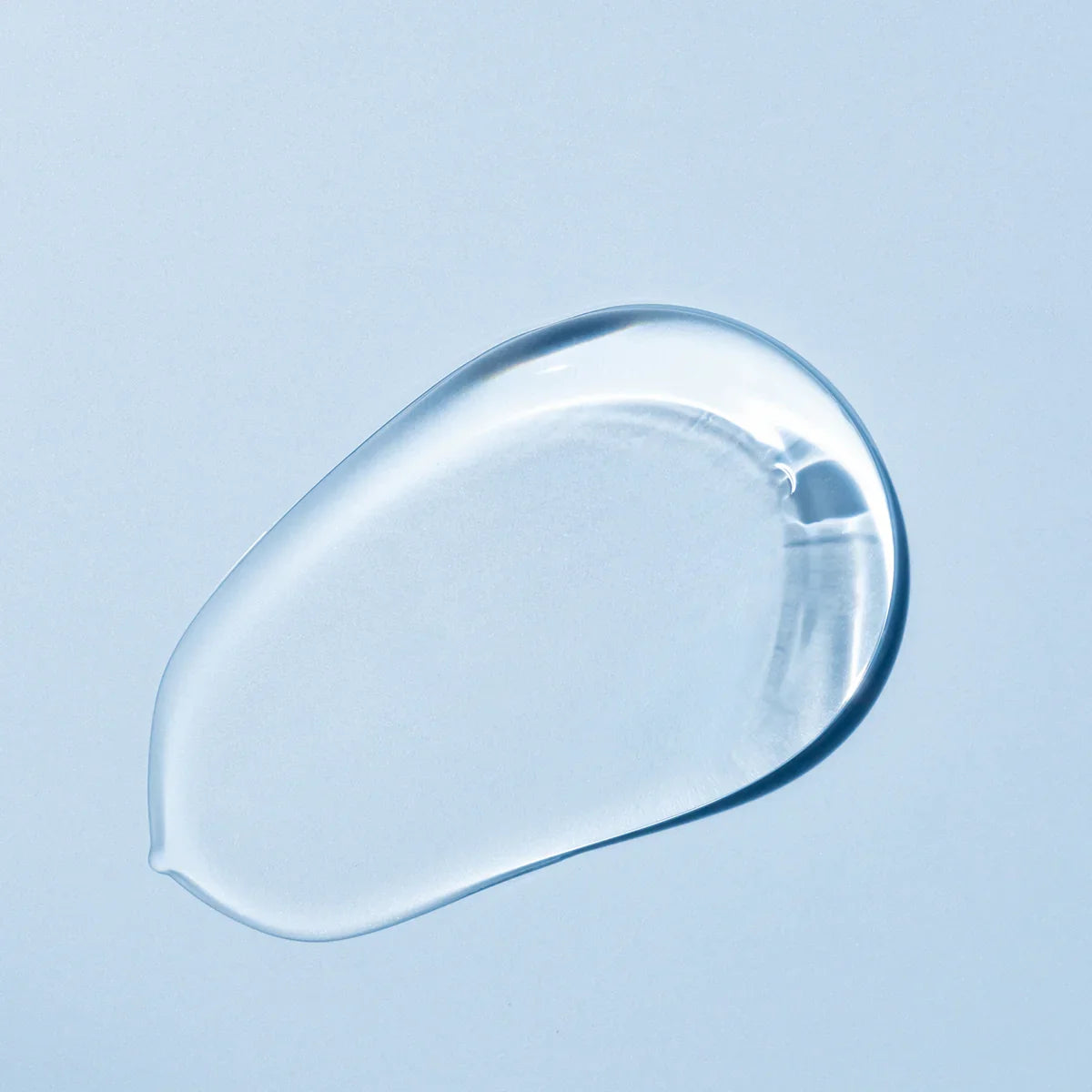 Clear gel-like substance on a light blue background
