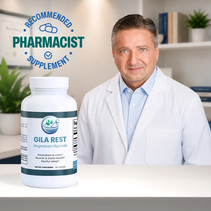 A bottle of Gila Rest Magnesium Glycinate dietary supplement placed on a white counter in front of a male pharmacist wearing a white lab coat. A blue circular badge in the top left reads 'RECOMMENDED PHARMACIST SUPPLEMENT'.