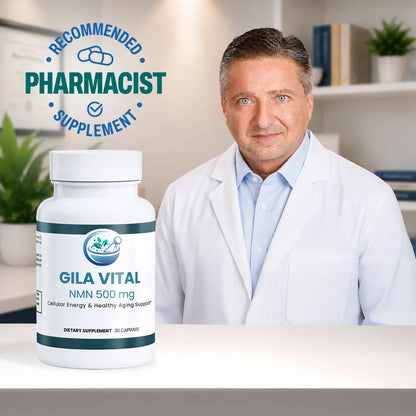 A white bottle of Gila Vital NMN 500 mg dietary supplement is shown in the foreground on a white table, with a male pharmacist in a white lab coat seated behind it in a bright office setting. A blue circular badge in the upper left reads 'Recommended Pharmacist Supplement'.