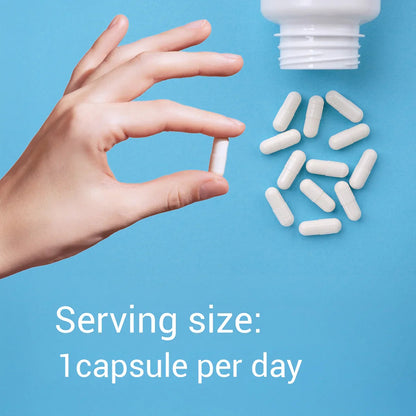 Hand holding a white capsule with text about serving size on a blue background